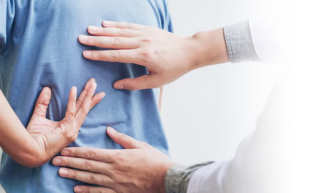 Man with back pain and our provider